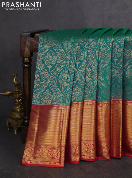 Pure kanchipuram silk saree dual shade of teal bluish green and red with allover zari woven brocade weaves and zari woven border