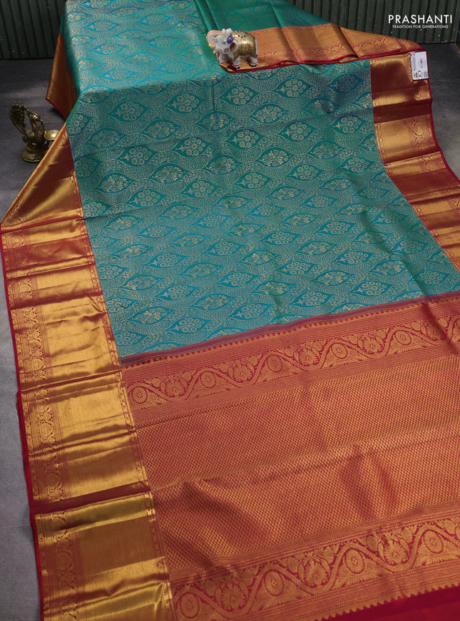 Pure kanchipuram silk saree dual shade of teal bluish green and red with allover zari woven brocade weaves and zari woven border