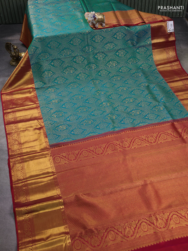 Pure kanchipuram silk saree dual shade of teal bluish green and red with allover zari woven brocade weaves and zari woven border
