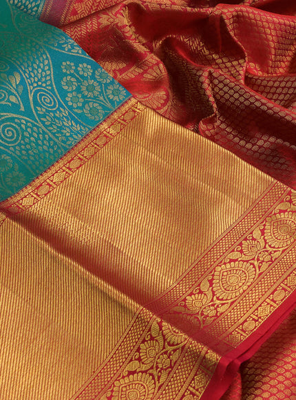 Pure kanchipuram silk saree dual shade of teal bluish green and red with allover zari woven brocade weaves and zari woven border