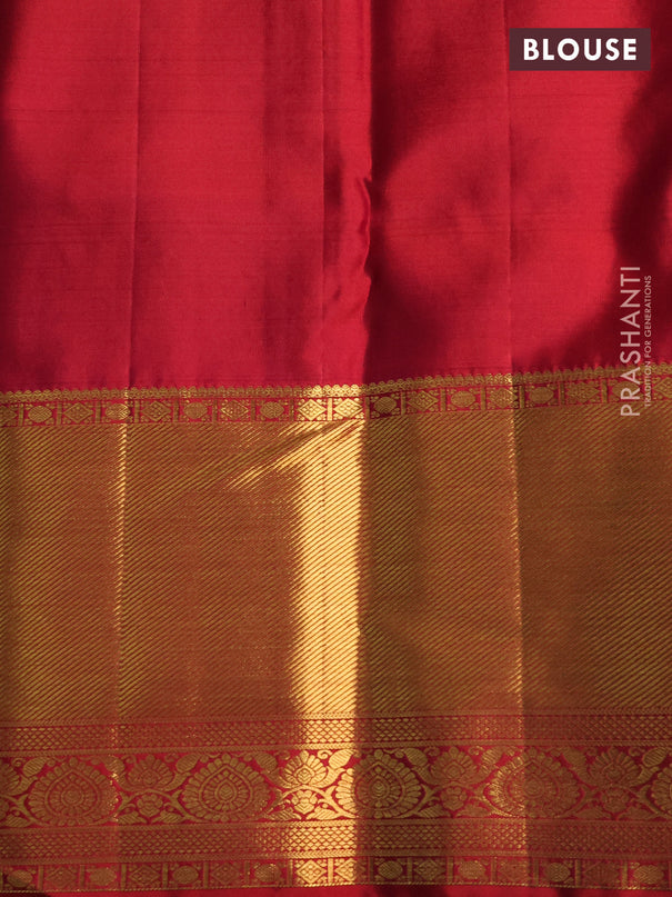 Pure kanchipuram silk saree dual shade of teal bluish green and red with allover zari woven brocade weaves and zari woven border