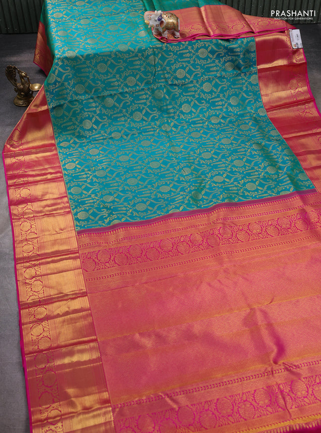 Pure kanchipuram silk saree dual shade of teal bluish green and pink with allover zari woven brocade weaves and zari woven border