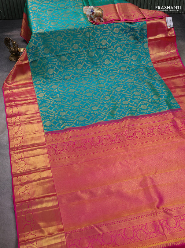 Pure kanchipuram silk saree dual shade of teal bluish green and pink with allover zari woven brocade weaves and zari woven border