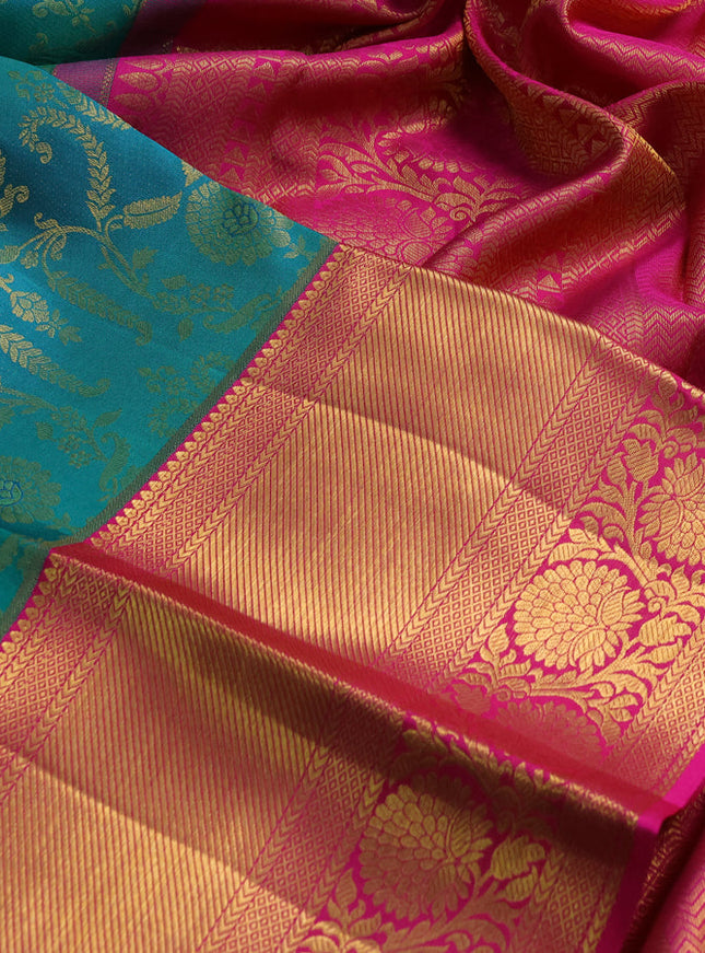 Pure kanchipuram silk saree dual shade of teal bluish green and pink with allover zari woven brocade weaves and zari woven border