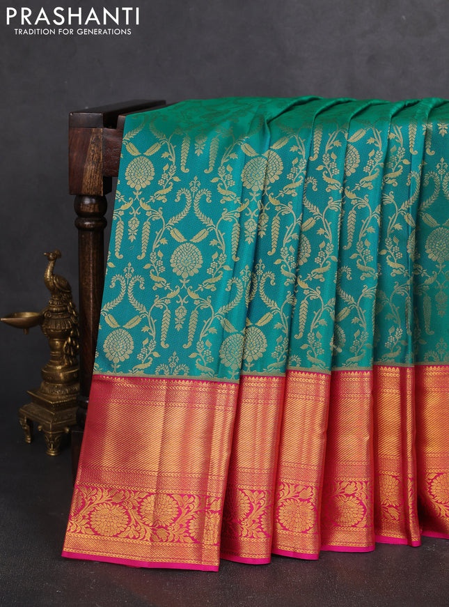Pure kanchipuram silk saree dual shade of teal bluish green and pink with allover zari woven brocade weaves and zari woven border