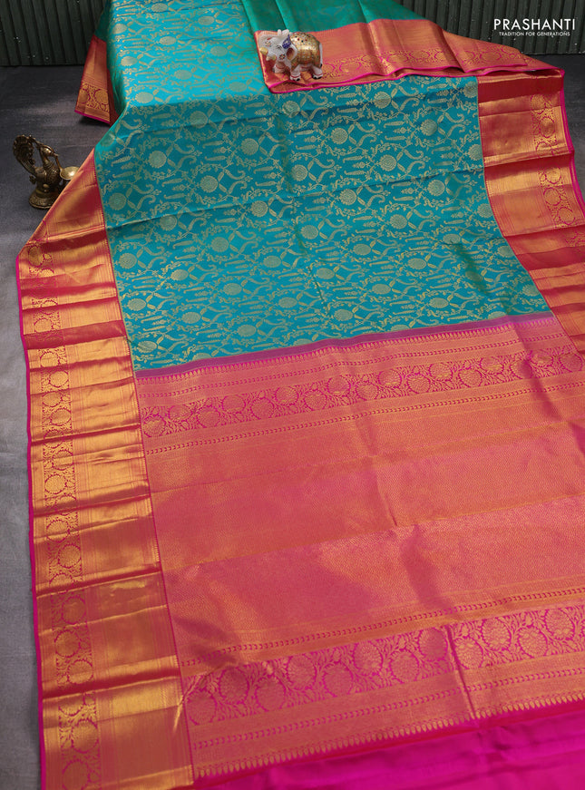 Pure kanchipuram silk saree dual shade of teal bluish green and pink with allover zari woven brocade weaves and zari woven border