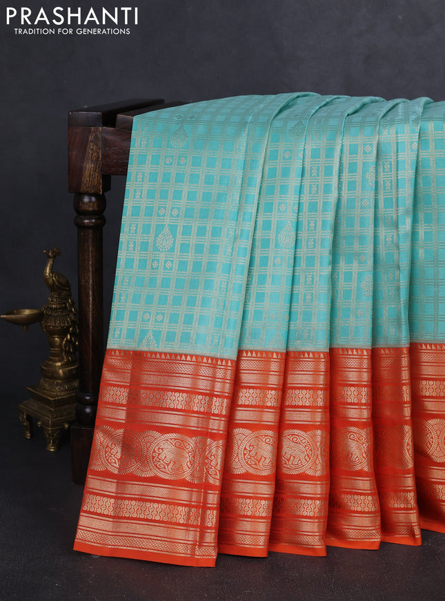 Pure kanchipuram silk saree teal blue and orange with allover zari checked pattern and zari woven border