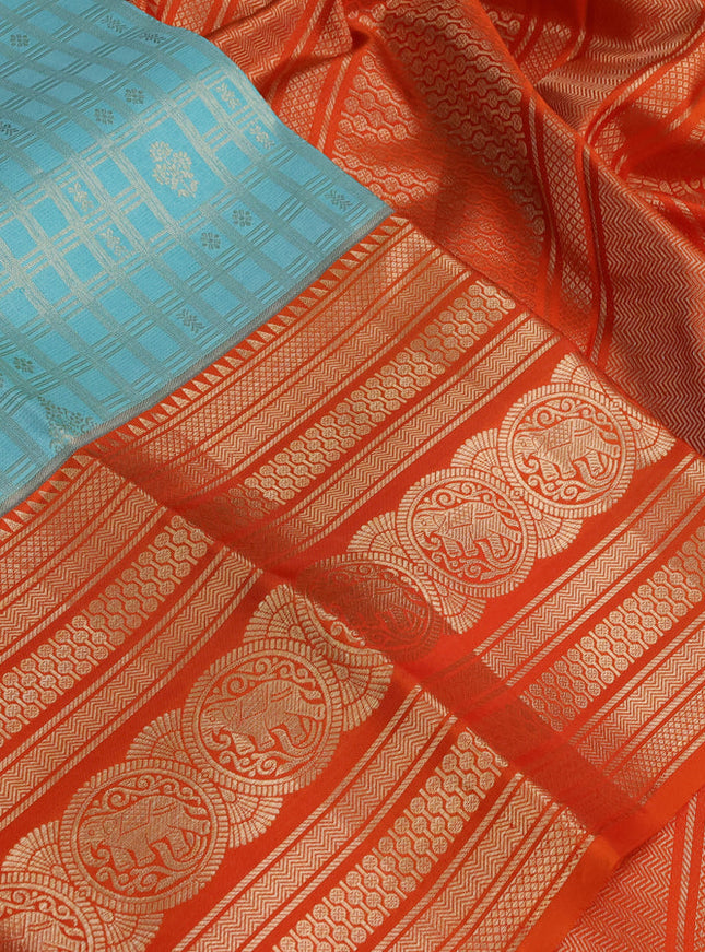 Pure kanchipuram silk saree teal blue and orange with allover zari checked pattern and zari woven border