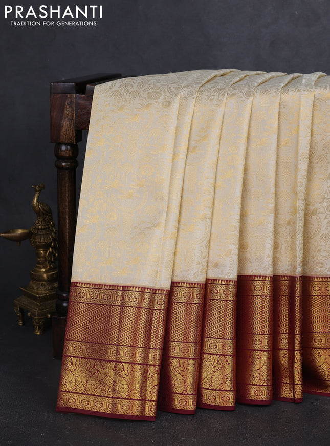 Pure kanchipuram silk saree off white and maroon with allover zari woven brocade weaves and zari woven border