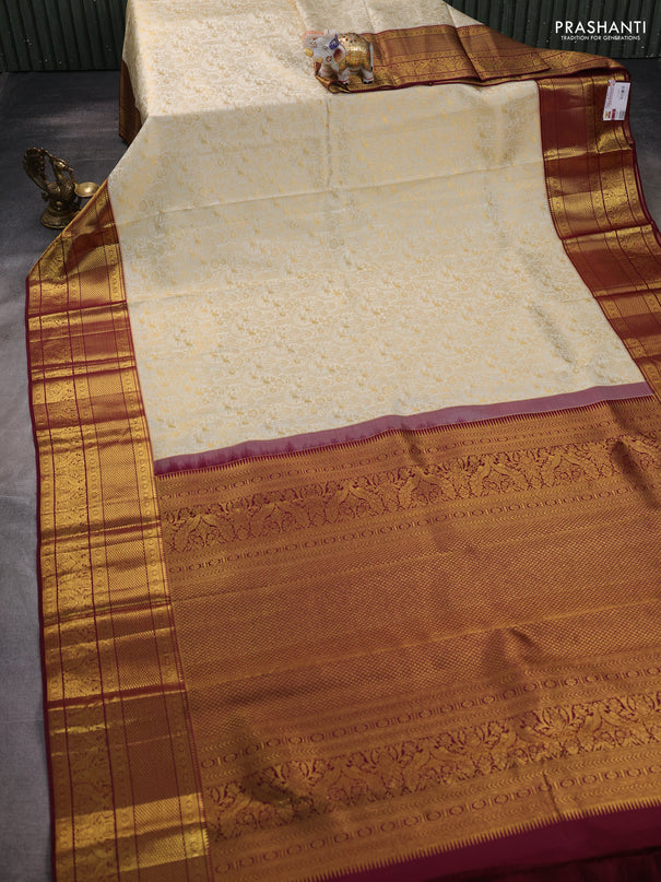 Pure kanchipuram silk saree off white and maroon with allover zari woven brocade weaves and zari woven border