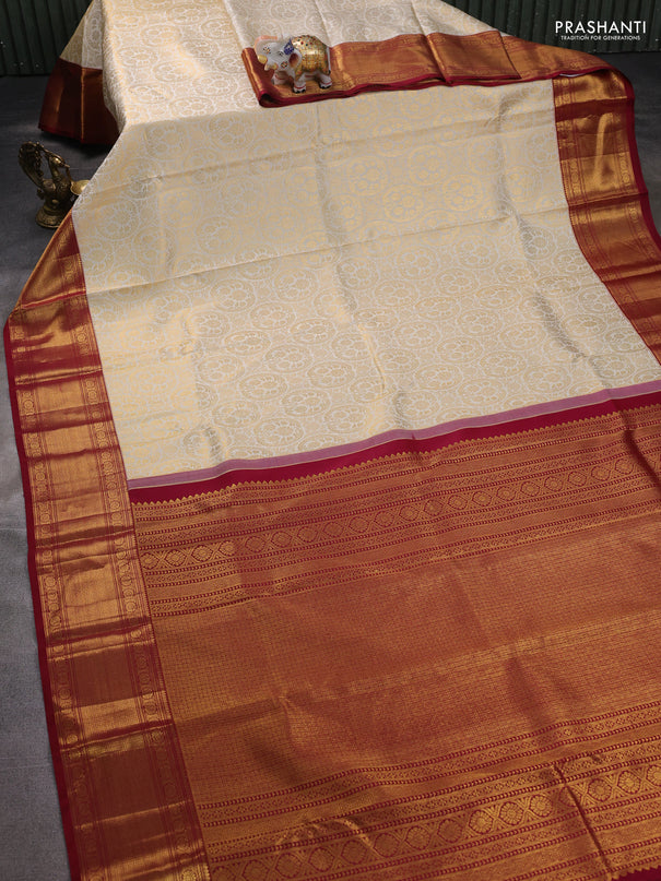 Pure kanchipuram silk saree off white and maroon with allover zari woven brocade weaves and zari woven border