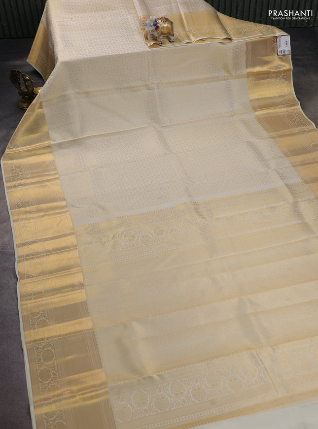 Pure kanchipuram silk saree off white with allover zari woven brocade weaves and zari woven border