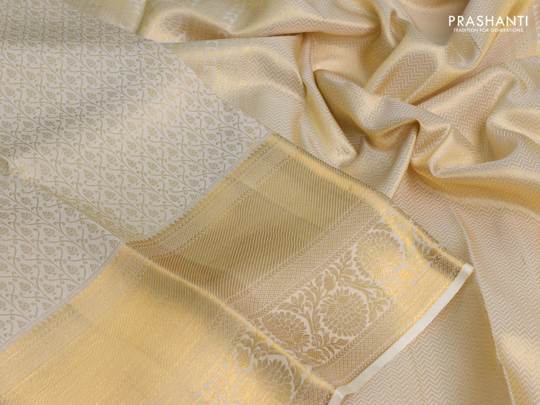 Pure kanchipuram silk saree off white with allover zari woven brocade weaves and zari woven border