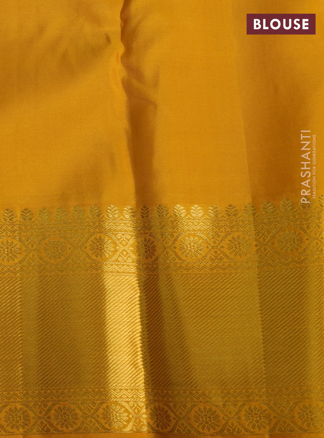 Pure kanchipuram silk saree off white and mustard yellow with allover zari woven brocade weaves and zari woven border