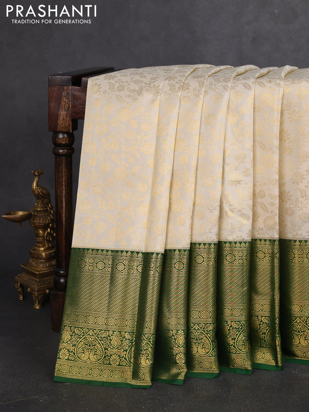Pure kanchipuram silk saree off white and green with allover zari woven brocade weaves and zari woven border