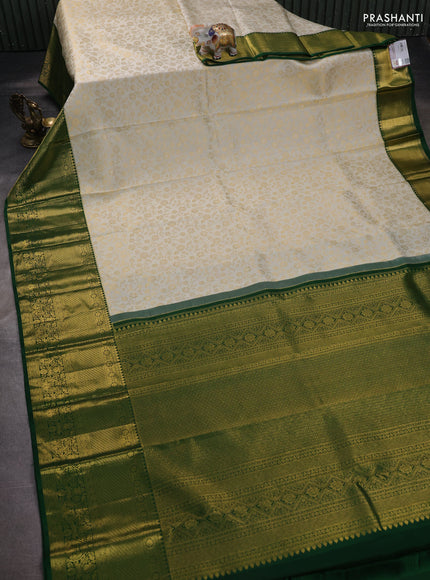 Pure kanchipuram silk saree off white and green with allover zari woven brocade weaves and zari woven border