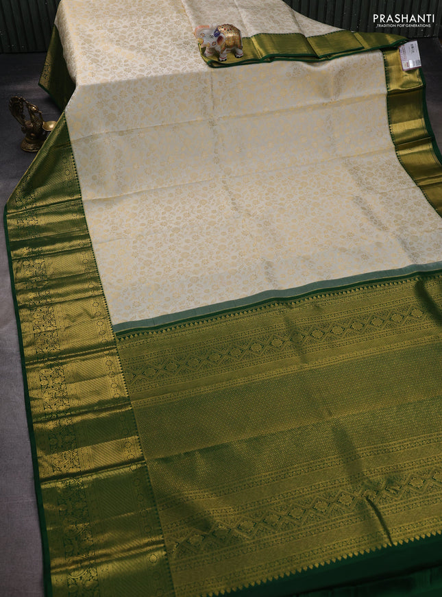 Pure kanchipuram silk saree off white and green with allover zari woven brocade weaves and zari woven border