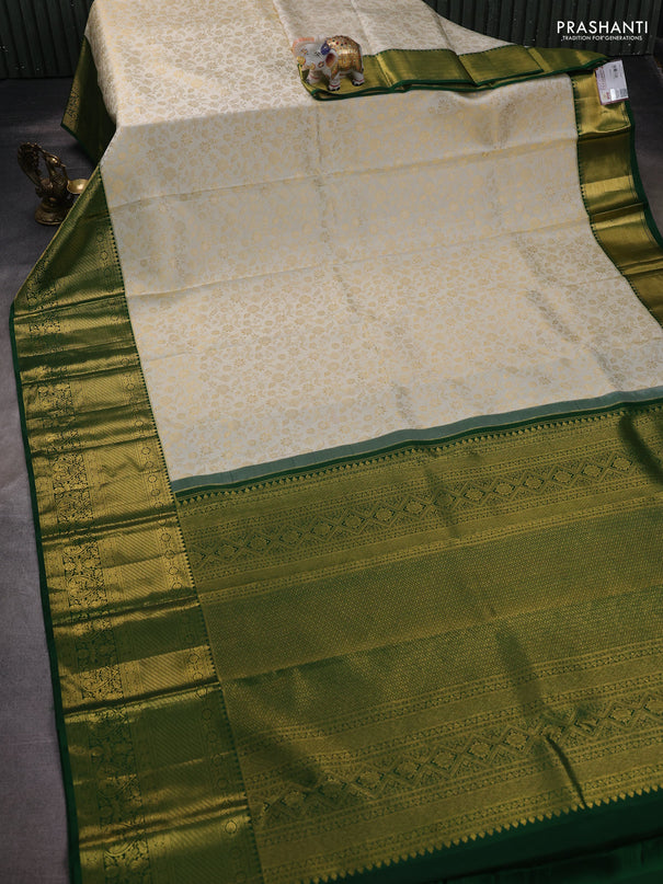 Pure kanchipuram silk saree off white and green with allover zari woven brocade weaves and zari woven border