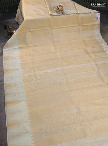 Pure kanchipuram silk saree off white with allover zari weaves and temple design zari woven border