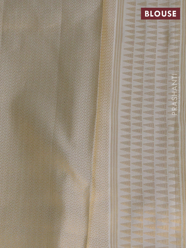 Pure kanchipuram silk saree off white with allover zari weaves and temple design zari woven border