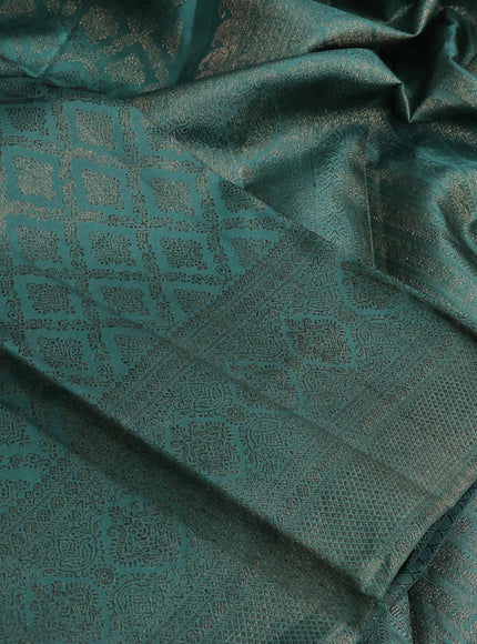 Pure kanchipuram silk saree teal green with allover antique zari weaves and woven border