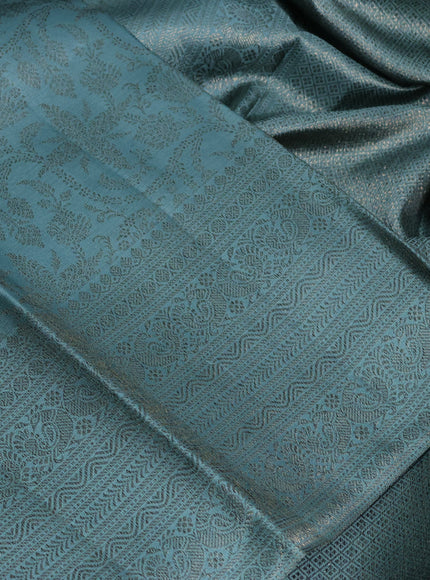Pure kanchipuram silk saree teal shade with allover antique zari weaves and woven border