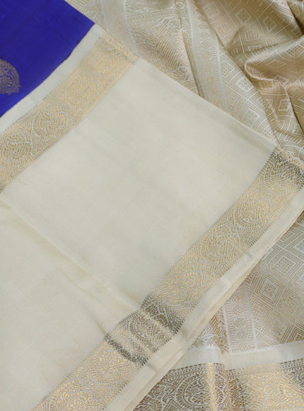 Pure kanchipuram silk saree blue and cream with paisley zari woven buttas and long rettapet zari woven korvai border