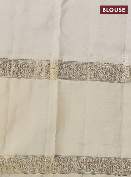 Pure kanchipuram silk saree blue and cream with paisley zari woven buttas and long rettapet zari woven korvai border