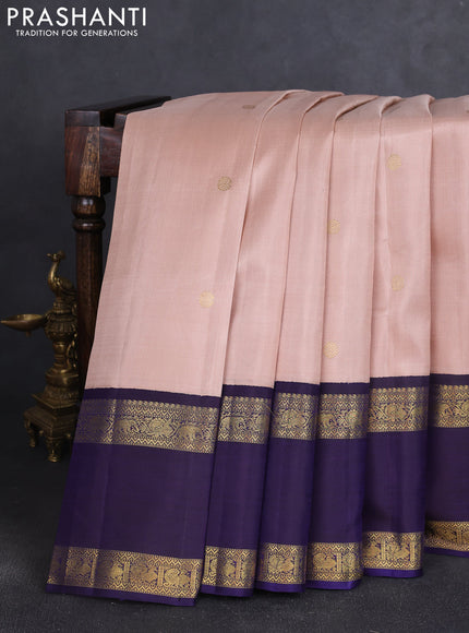 Pure kanchipuram silk saree pastel peach and dual shade of jamun with zari woven buttas and long rettapet zari woven korvai border