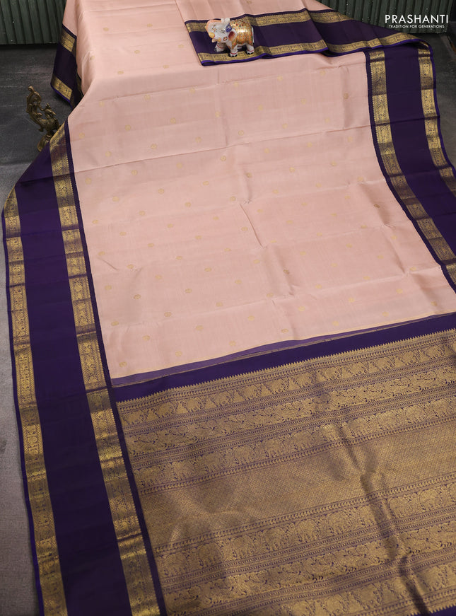 Pure kanchipuram silk saree pastel peach and dual shade of jamun with zari woven buttas and long rettapet zari woven korvai border