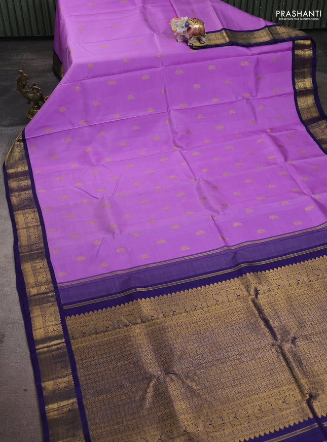 Pure kanchipuram silk saree lavender and dark blue with paisley & annam zari woven buttas and rich zari woven korvai border