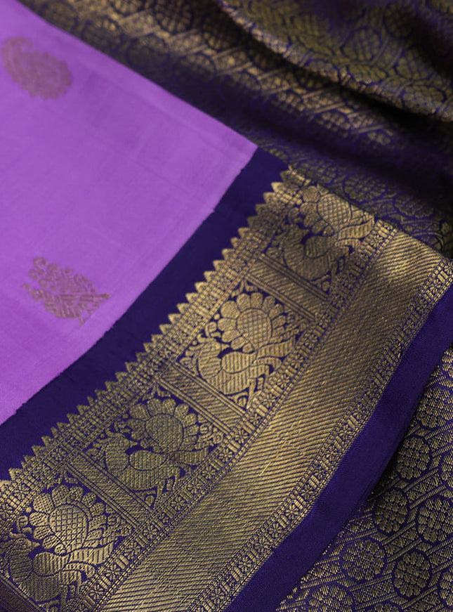 Pure kanchipuram silk saree lavender and dark blue with paisley & annam zari woven buttas and rich zari woven korvai border