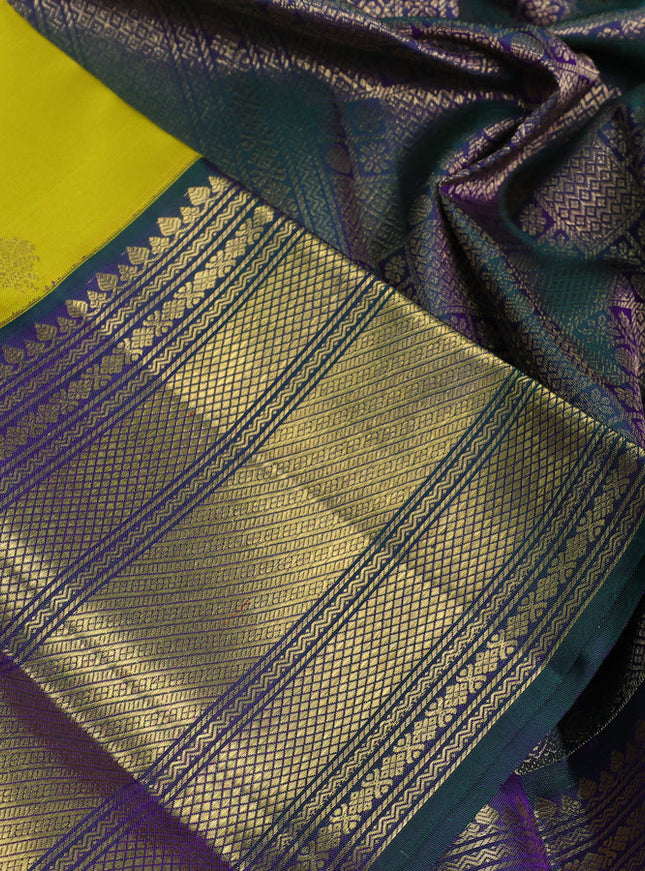 Pure kanchipuram silk saree lime yellow and dual shade of greenish violet with zari woven buttas and rich zari woven korvai border