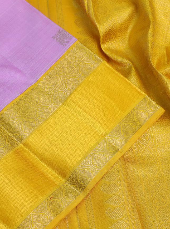 Pure kanchipuram silk saree mild lavender and yellow with zari woven buttas and rich zari woven korvai border
