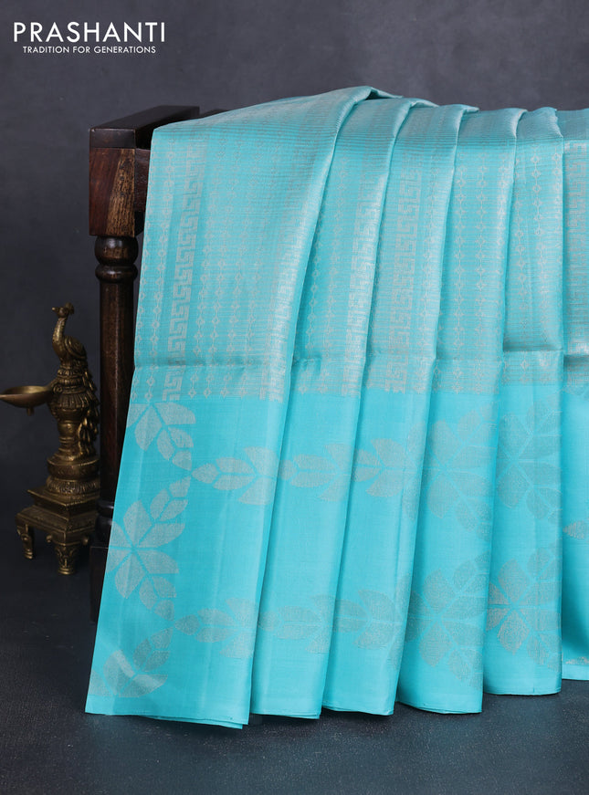 Pure soft silk saree teal blue and purple with allover zari brocade weaves and long zari woven butta border