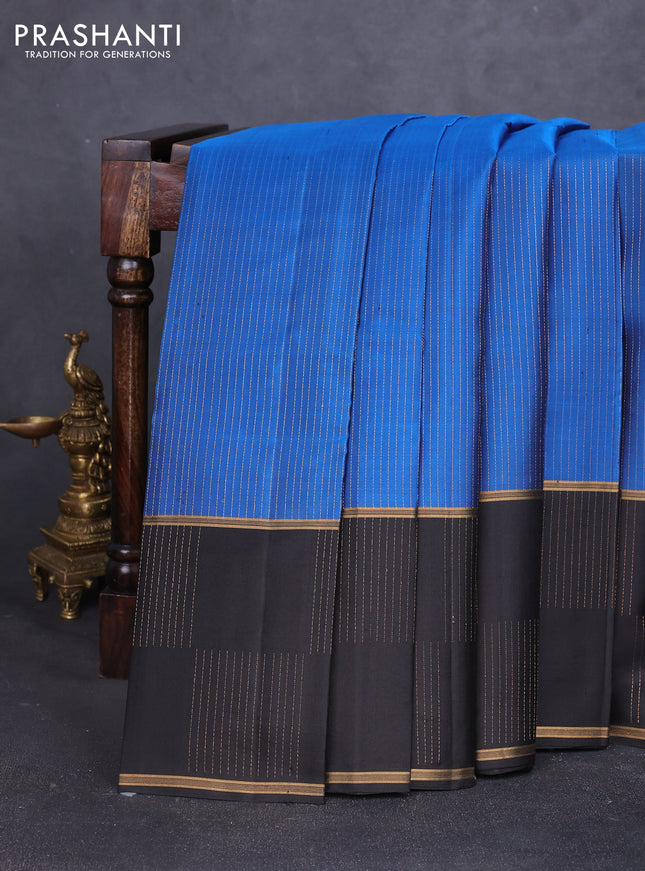 Pure soft silk saree blue and black with allover zari stripes pattern and rettapet zari woven border