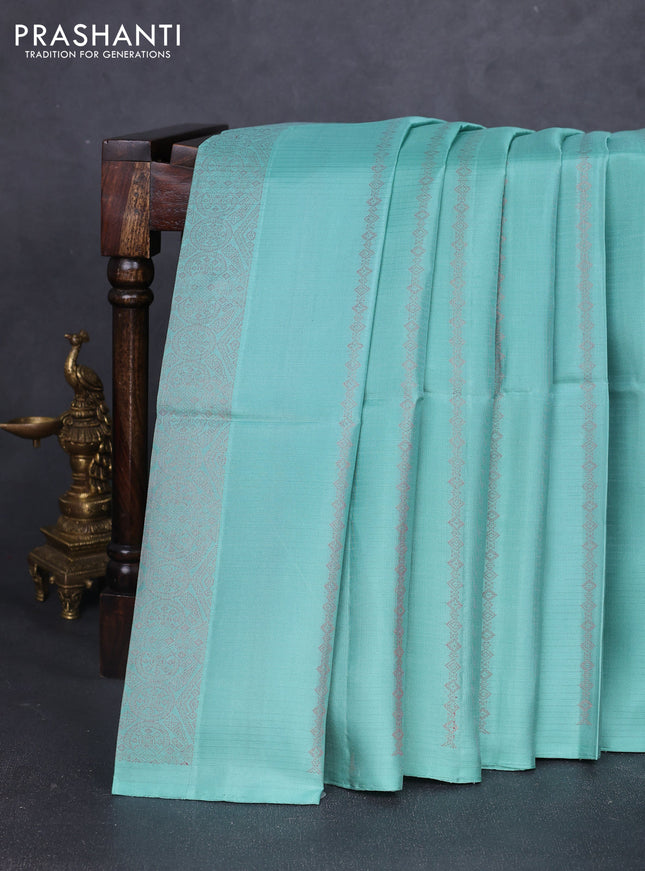 Pure soft silk saree pastel green and black with allover thread zari woven buttas and piping border