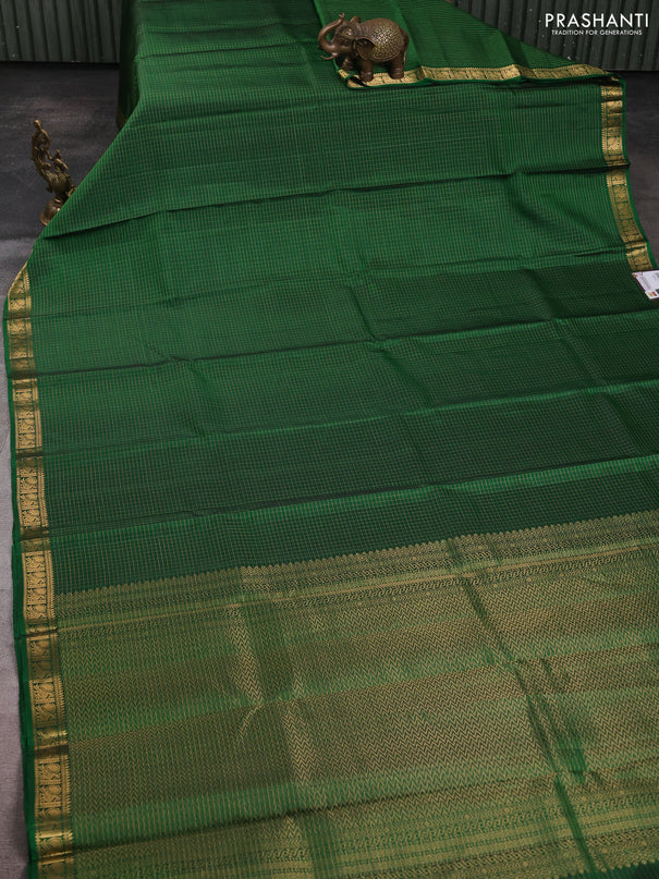 Pure soft silk saree green with allover zari checks pattern and zari woven border