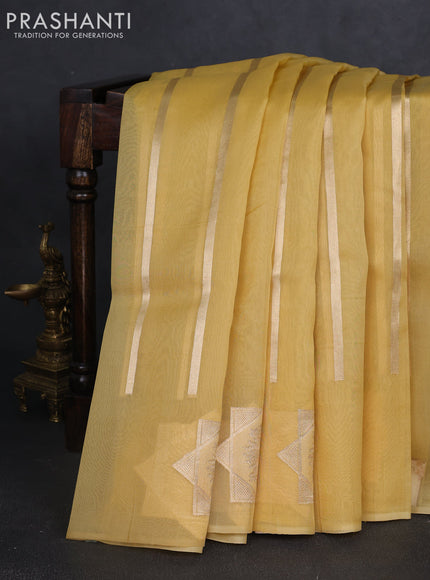Banarasi organza silk saree pale yellow with allover zari stripes pattern and zari woven butta border