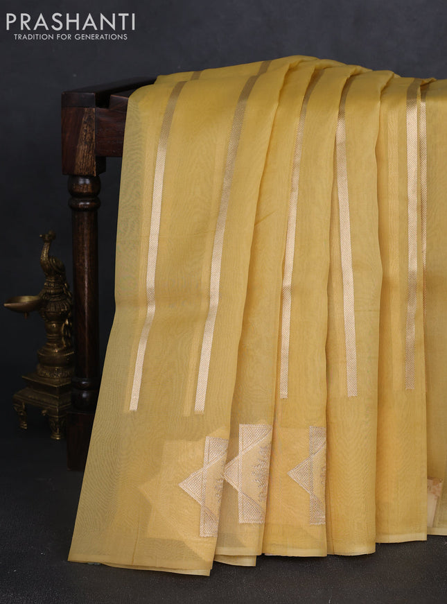 Banarasi organza silk saree pale yellow with allover zari stripes pattern and zari woven butta border