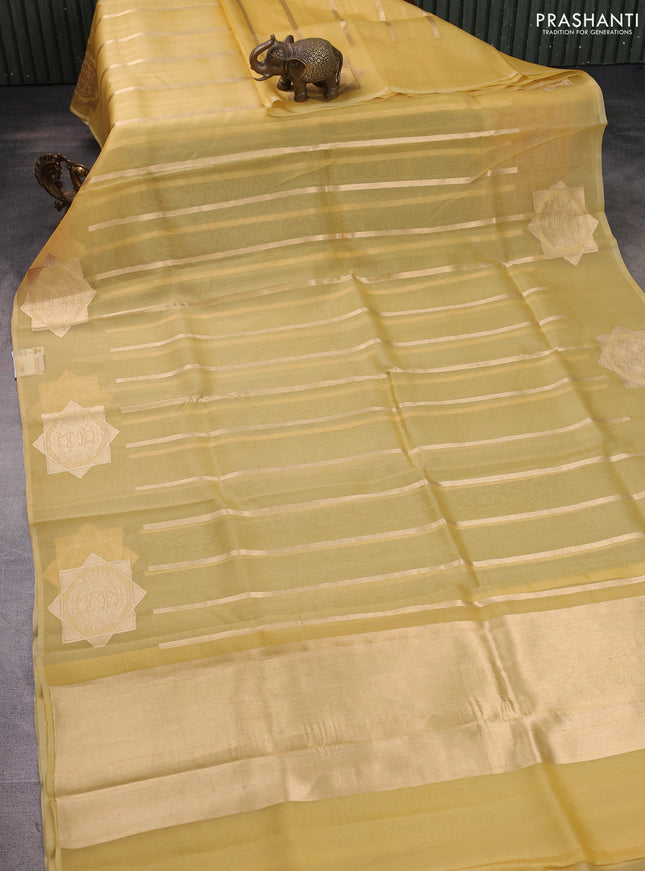 Banarasi organza silk saree pale yellow with allover zari stripes pattern and zari woven butta border