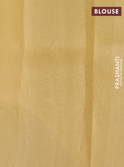 Banarasi organza silk saree pale yellow with allover zari stripes pattern and zari woven butta border