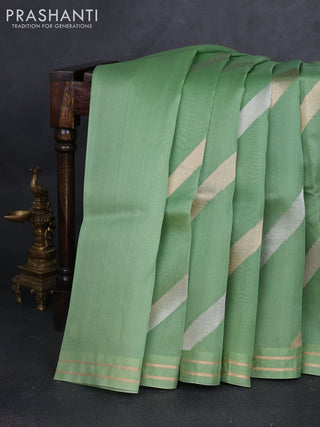 Banarasi organza silk saree green shade with allover silver & gold zari weaves and zari woven border