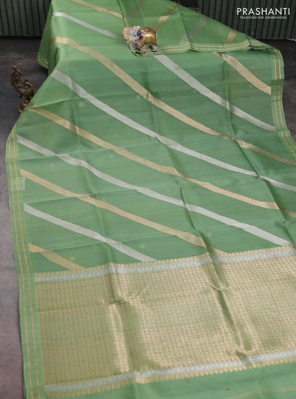 Banarasi organza silk saree green shade with allover silver & gold zari weaves and zari woven border