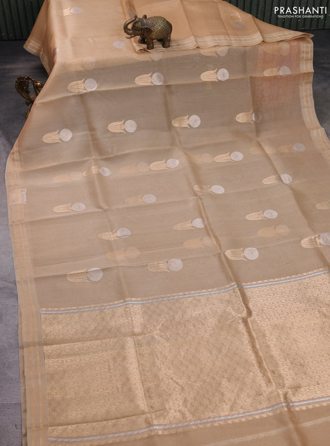 Banarasi organza silk saree sandal with floral zari woven buttas and zari woven border