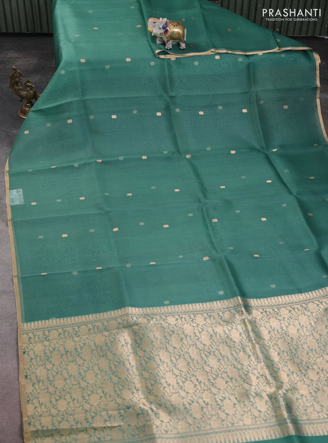 Banarasi organza silk saree pastel green with allover zari woven buttas and zari woven border