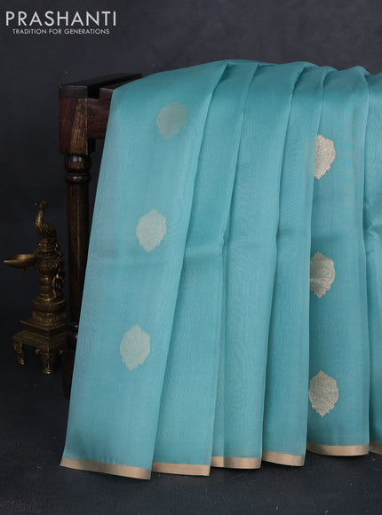 Banarasi organza silk saree teal blue with zari woven buttas and zari woven border
