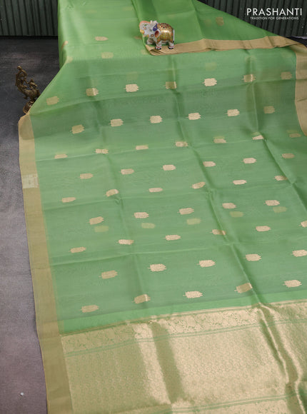 Banarasi organza silk saree light green with zari woven buttas and zari woven border