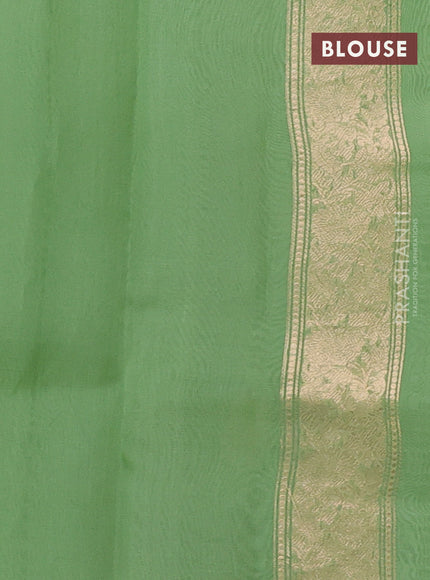 Banarasi organza silk saree light green with zari woven buttas and zari woven border