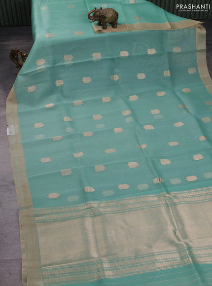 Banarasi organza silk saree teal green with prints & sequin embroidery work and zari woven border